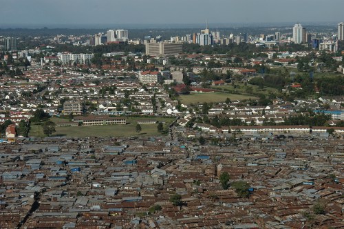 FILE -An aerial view of the slum of Kibera with the Nairobi skyline in the background, Kenya, Jan. 4, 2008. (AP Photo/Riccardo Gangale, File)