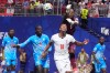 FILE - Congo goalkeeper Lionel Mpasi makes a save over England's Jude Bellingham during a World Cup round of 32 soccer match in Atlanta, on July 1, 2026. (AP Photo/Mike Stewart, File)