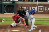 Los Angeles Dodgers' Enrique Hernández follows through on a two-run home run as Atlanta Braves catcher Drake Baldwin (30) and umpire James Hoye look on during the fourth inning in Game 3 of baseball's National League Division Series, Tuesday, Oct. 6, 2026, in Atlanta. (AP Photo/Mike Stewart)