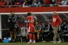 Chicago Fire's Jonathan Bamba (19) hugs assistant coach Tom Heinemann, back, after scoring a goal during the first half of an MLS soccer match against the Vancouver Whitecaps Tuesday, Oct. 6, 2026, in Chicago. (AP Photo/Paul Beaty)