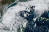 This satellite image from the National Oceanic and Atmospheric Administration shows Tropical Depression Nine forming over the Gulf of Mexico on Tuesday, Oct. 6, 2026. (NOAA via AP)