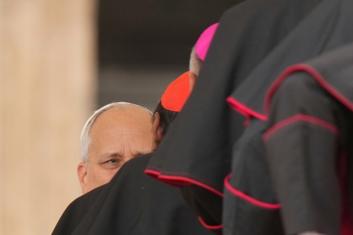 Pope Leo XIV is greeted by cardinals and bishops at the end of his weekly general audience in St. Peter's Square, at the Vatican, Wednesday, Oct. 7, 2026. (AP Photo/Andrew Medichini)