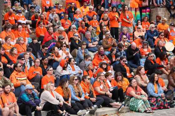 People attend the opening ceremony for the Orange Shirt Day Healing Walk at the Oodena Circle at The Forks. (Brook Jones / Free Press)