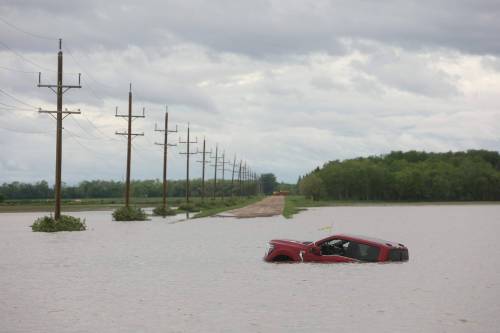 Tim Smith / The Brandon Sun Files
                                Swathes of farm land were submerged and municipal roads and provincial highways were washed out by overland flooding from western Manitoba to the Interlake after severe flooding hit several communities in June and July.