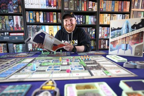 RUTH BONNEVILLE / FREE PRESS 
                                Kinson Key Games co-founder Dennis Northcott displays his company&rsquo;s Galactic Cruise board game in his Winnipeg home. The game has sold some 50,000 copies and nabbed several awards.