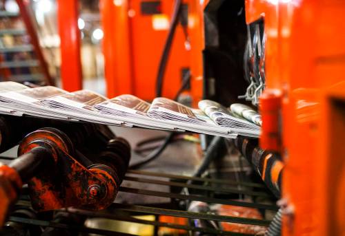 MIKAELA MACKENZIE / FREE PRESS
                                Newspapers run off the presses at the Free Press.