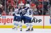 Winnipeg Jets center Cole Perfetti (91) celebrates after his goal against the Detroit Red Wings with left wing Kyle Connor, left, and center Mark Scheifele (55) during the first period of an NHL hockey game Sunday, Oct. 4, 2026, in Detroit. (Duane Burleson / The Associated Press)