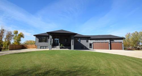 Situated on a four-acre lot just minutes from the city, the sprawling 2,650 sq. ft bungalow offers a peaceful country feel.