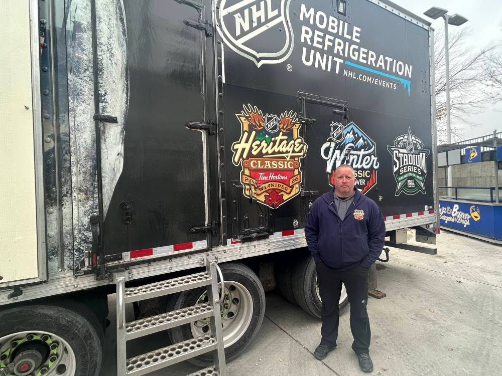 MIKE MCINTYRE / FREE PRESS
Derek King, the NHL’s vice-president of hockey operations and facilities operations, shows off the league’s mobile refrigeration unit at Princess Auto Stadium on Tuesday.