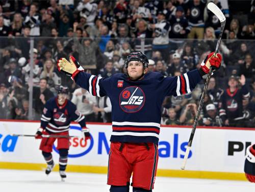 Fred Greenslade / THE CANADIAN PRESS
                                Winnipeg Jets&rsquo; Cole Perfetti celebrates his goal against the Minnesota Wild as Blake Coleman looks on during the second period.