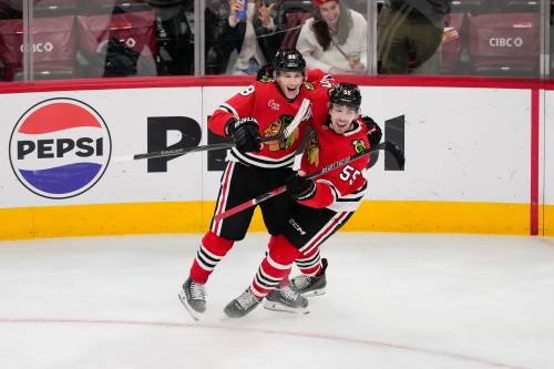Harry Figiel / The Associated Press
                                Chicago Blackhawks right wing Patrick Kane, left, celebrates the game-winning overtime goal by defenceman Artyom Levshunov in their 4-3 victory over the Winnipeg Jets, Thursday in Chicago.