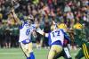 CODIE McLACHLAN / THE CANADIAN PRESS
                                Winnipeg Blue Bombers quarterback Zach Collaros (8) throws a pass under pressure from Edmonton Elks&rsquo; Kenny Logan Jr. (20) and Robbie Smith (40) during first half action in Edmonton on Friday.