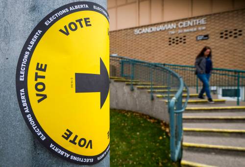 A voter leaves a polling station after casting their vote in the Alberta referendum in Calgary, Monday, Oct. 19, 2026. THE CANADIAN PRESS/Jeff McIntosh