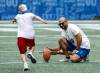 JOHN WOODS / FREE PRESS FILES
                                Winnipeg Blue Bombers kicker Sergio Castillo, holding during a KidSport football camp, is doing something he loves and understands it comes at a cost.