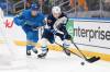 Jeff Roberson / The Associated Press
                                Winnipeg Jets&rsquo; Viggo Björck (61) and St. Louis Blues&rsquo; Colton Parayko (55) battle for a loose puck during the first period.
