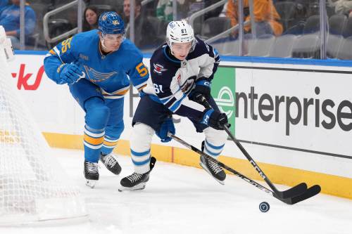 Jeff Roberson / The Associated Press
                                Winnipeg Jets&rsquo; Viggo Björck (61) and St. Louis Blues&rsquo; Colton Parayko (55) battle for a loose puck during the first period.