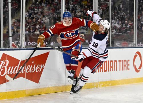 FRED GREENSLADE / THE CANADIAN PRESS
                                Winnipeg Jets&rsquo; Dawson Mercer (19) is checked by Montreal Canadiens&rsquo; Lane Hutson (48) during first period NHL Heritage Classic action in Winnipeg on Sunday, Oct. 25, 2026.