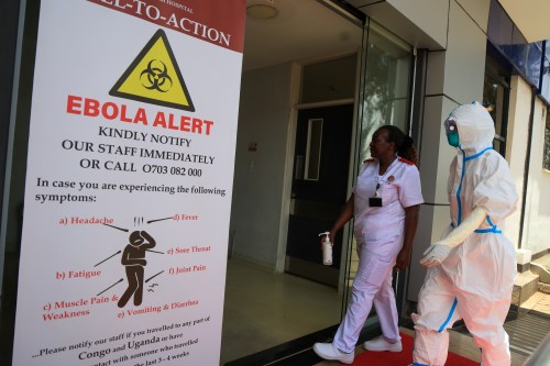 Health workers and officials walk outside a Ebola isolation facility at The Nairobi Hospital, Kenya, Wednesday, Oct. 7, 2026. (AP Photo/Andrew Kasuku)