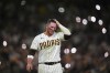 San Diego Padres' Ty France reacts after he was forced out by Milwaukee Brewers second baseman Brice Turang during the sixth inning in Game 4 of baseball's National League Division Series Wednesday, Oct. 7, 2026, in San Diego. (AP Photo/Gregory Bull)