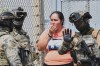 A relative of an inmate speaks with some Mexican Navy officers during a riot at the El Castillo Penitentiary in Mazatlan, Mexico, Thursday, Oct. 8, 2026. (AP Photo/Fausto Camacho)