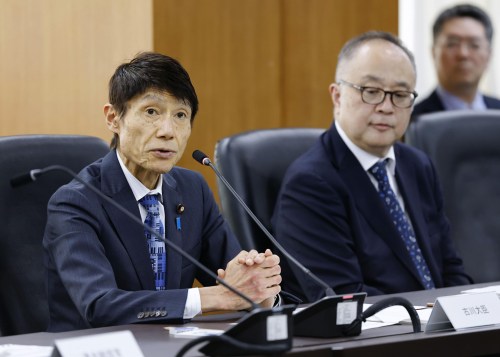 Japan's Minister for Digital Transformation Toshiharu Furukawa, left, attends during an interministerial meeting in Tokyo, Japan, Thursday, Oct. 8, 2026. (Kyodo News via AP)