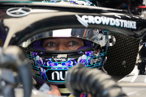Mercedes driver George Russell, of Britain, sits on his car at pits before the first free practice ahead of the Singapore Formula One Grand Prix, in Singapore, Friday, Oct. 9, 2026. (AP Photo/Vincent Thian)