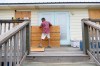 Larry Smith boards up his home with plywood ahead of Hurricane Isaias' expected landfall along the Gulf Coast in Dauphin Island, Alabama, Thursday, Oct. 8, 2026. (AP Photo/Octavio Jones)