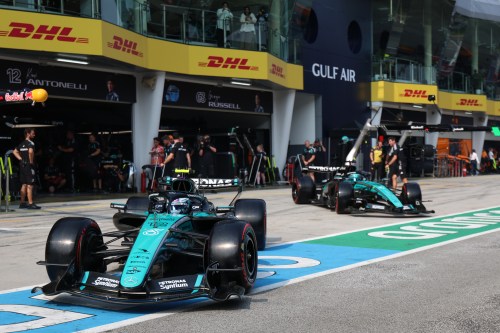 Mercedes driver Andrea Kimi Antonelli of Italy, left, and his teammate George Russell of Britain steer their cars out from the garage during the qualifying session for the Bahrain Grand Prix in Sepang, Malaysia, Saturday, Oct. 3, 2026. (Annice Lyn/Pool via AP )