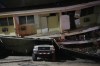 A vehicle lies crushed beneath a collapsed building after an earthquake struck Penonome, Panama, Friday, Oct. 9, 2026. (AP Photo/Aris Mariota)