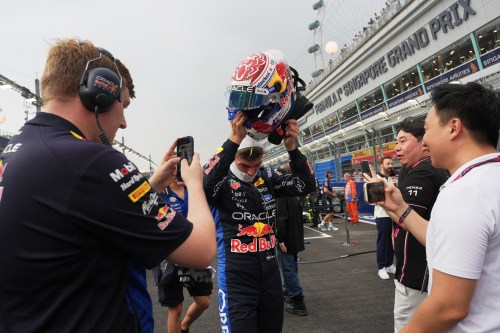 Red Bull driver Max Verstappen, center, of the Netherlands prepares for the sprint race ahead of the Singapore Formula One Grand Prix in Singapore, Saturday, Oct. 10, 2026. (AP Photo/Ng Han Guan)