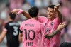 Inter Miami forward Luis Suarez, right, celebrates with forward Lionel Messi after scoring his side's second goal during the first half of an MLS soccer match against D.C. United, Saturday, Oct. 10, 2026, in Miami. (AP Photo/Rebecca Blackwell)