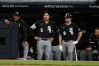 Chicago White Sox first baseman Munetaka Murakami (5) and catcher Kyle Teel (8) watch from the dugout during the eighth inning of Game 5 of baseball's American League Division Series against the Cleveland Guardians, Saturday, Oct. 10, 2026, in Cleveland. (AP Photo/Phil Long)