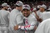 Cleveland Guardians third baseman José Ramírez, center, celebrates after Game 5 of baseball's American League Division Series against the Chicago White Sox, Saturday, Oct. 10, 2026, in Cleveland. (AP Photo/Sue Ogrocki)