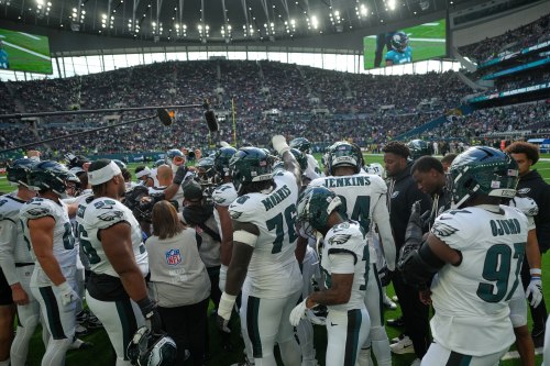 Philadelphia Eagles players gather during the warm-up before an NFL football game against Jacksonville Jaguars in London, Sunday, Oct. 11, 2026. (AP Photo/Alastair Grant)