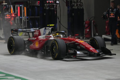Ferrari driver Lewis Hamilton of Britain arrives for a pit service during the Singapore Formula One Grand Prix race in Singapore, Sunday, Oct. 11, 2026. (AP Photo/Ng Han Guan, Pool)