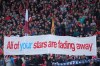 Fans display a banner as they cheer at the stand prior the English Premier League soccer match between Liverpool and Manchester City in Liverpool, England, Sunday, Oct. 11, 2026. (AP Photo/Jon Super)
