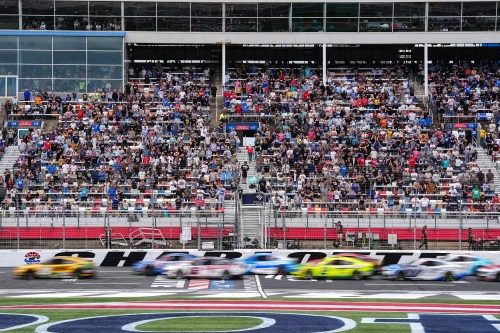 A pack of cars come to a green flag restart during a NASCAR Cup Series auto race, Sunday, Oct. 11, 2026, in Concord, N.C. (AP Photo/Matt Kelley)