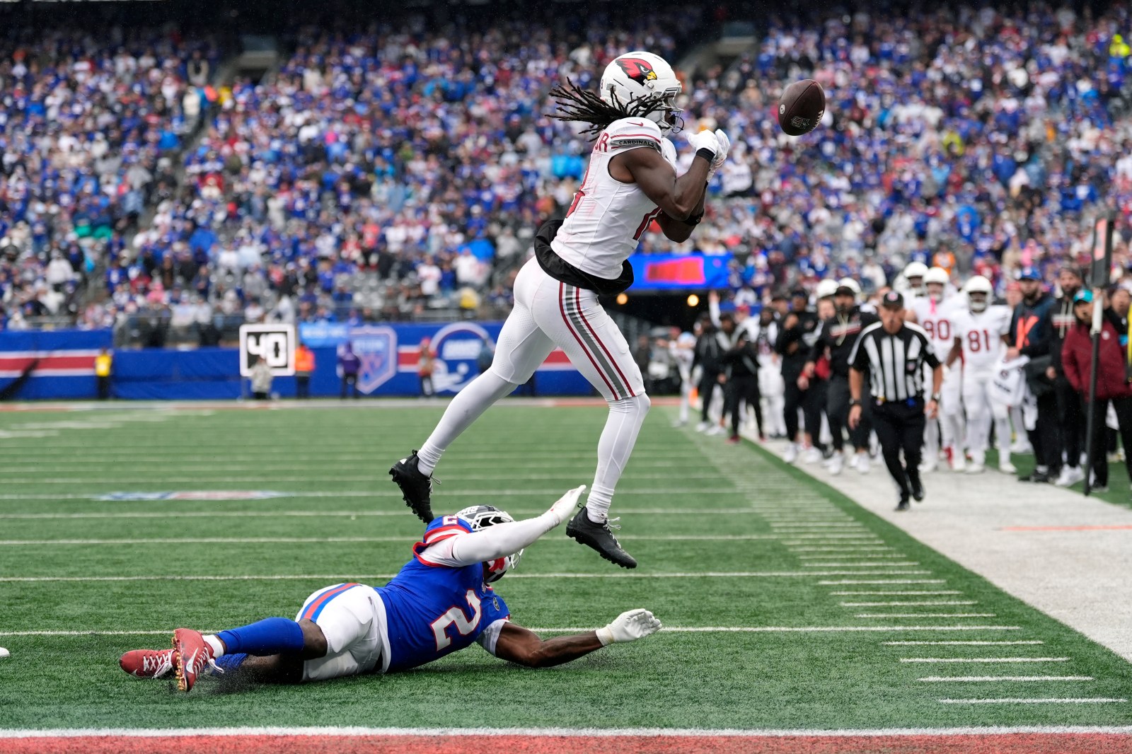 Cardinals end bizarre week by trading Harrison, getting thumped by Lions