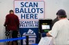 Voters scan their ballots at early in-person voting in Cleveland, Wednesday, Oct. 7, 2026. (AP Photo/Sue Ogrocki)