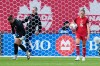 Canada goalkeeper Kailen Sheridan, left, and teammate Janine Sonis react after Denmark's Olivia Holdt, not shown, scored her country's third goal during an international women's soccer friendly in Toronto on Oct. 12, 2026. THE CANADIAN PRESS/Chris Young