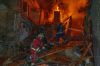 Firefighters put out a fire following a Russian air attack on a residential building in Kharkiv, Ukraine, Tuesday, Oct. 13, 2026. (AP Photo/Andrii Marienko)