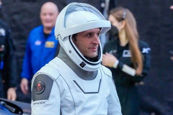 Astronaut Joshua Kutryk leaves the Operations and Checkout Building at the Kennedy Space Center in Cape Canaveral, Fla., Oct. 1. (John Raoux / The Associated Press files)