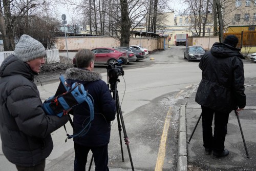 FILE - Journalists stand next to an entrance of the Lefortovo prison, in Moscow, Thursday, March 30, 2023. (AP Photo/Alexander Zemlianichenko, Pool)
