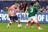 U.S. forawrd Cavan Sullivan (8) drives on Mexico defenseman Diego Vasquez in the second half of an international friendly soccer match in Glendale, Ariz., Saturday, Oct. 3, 2026. (AP Photo/Rick Scuteri)