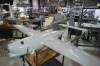 In this file photo taken Wednesday, Sept. 25, 2024, a worker assembles a Raybird long-range surveillance drone at the Skyeton drone-manufacturing hub in the Kyiv region, Ukraine. (AP Photo/Efrem Lukatsky)
