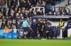 Referee Edward Duckworth speaks to Millwall manager Alex Neil and Swansea City manager Vitor Matos on the touchline while play is suspended during the Sky Bet Championship match at The Den, London, Tuesday Oct. 13, 2026. (Ben Whitley/PA via AP)