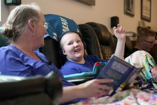 William Walter, 11, and his mother, Katherine, read a book together during homeschooling hours in White Sulphur Springs, Mont., July 16, 2026. (AP Photo/Shelby Lum)