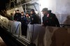 Four of the saved sailors from the drone-attacked and sunk ship HS Dignity seen on emergency rescue tug of Bulgarian Navy's - Mizar as they are transported to the port of Varna, Bulgaria, late Tuesday, Oct. 13, 2026. (Moreto.net via AP)