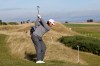 England's Tommy Fleetwood, center, plays a shot on the 5th hole during the day two of the 2026 Alfred Dunhill Links Championship at the Kingsbarns Golf Course in St Andrews, Scotland, Friday, Oct. 2, 2026. (Steve Welsh/PA via AP)