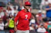 Philadelphia Phillies interim manager Don Mattingly walks to the mound against the Atlanta Braves in the seventh inning during Game 2 of baseball's National League Wild Card Series Wednesday, Sept. 30, 2026, in Atlanta. (AP Photo/Brynn Anderson)